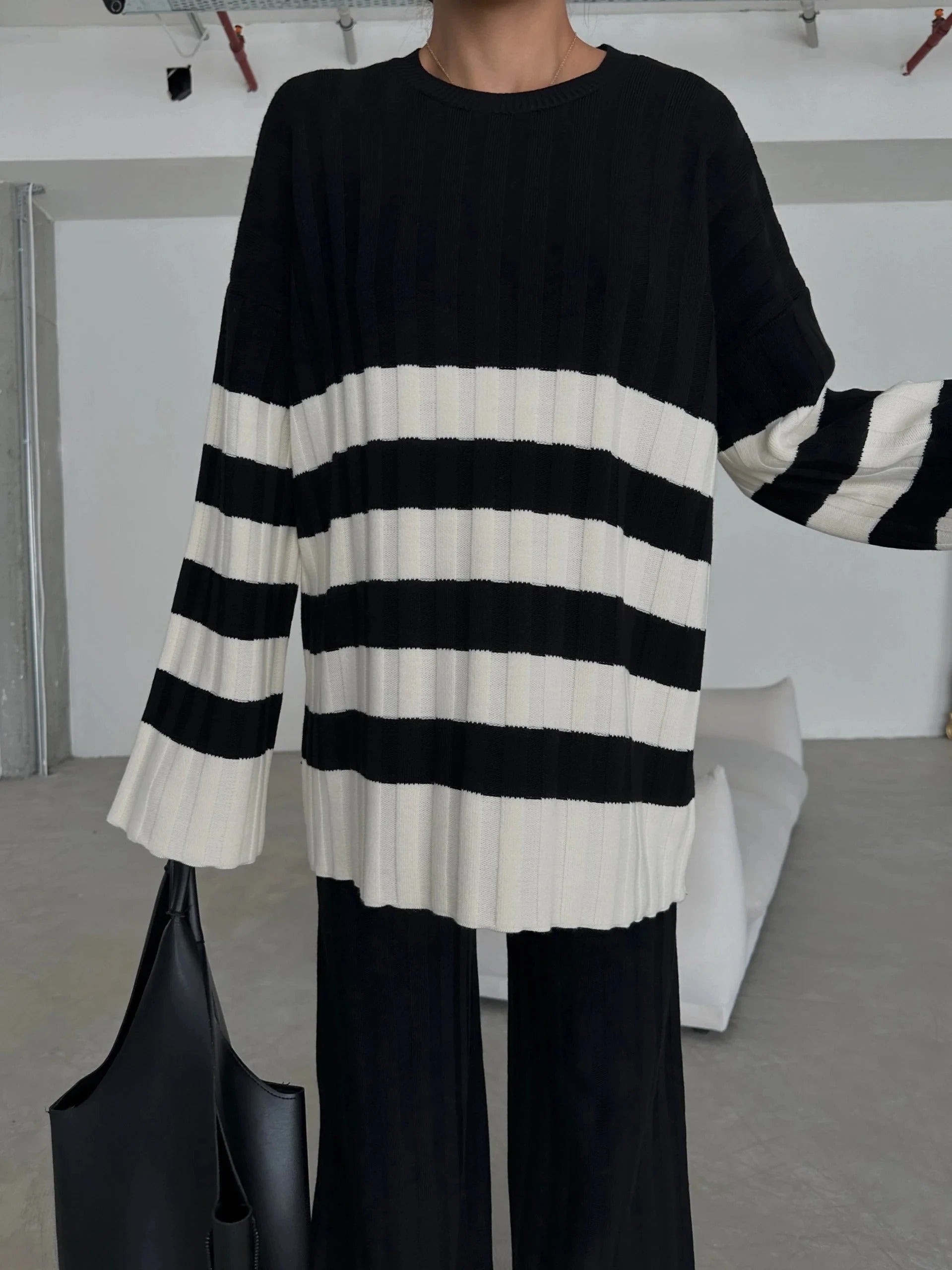 Black and cream striped knit set with sweater and wide-leg pants