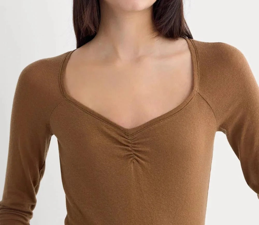Brown fitted long sleeve top with ruched detail