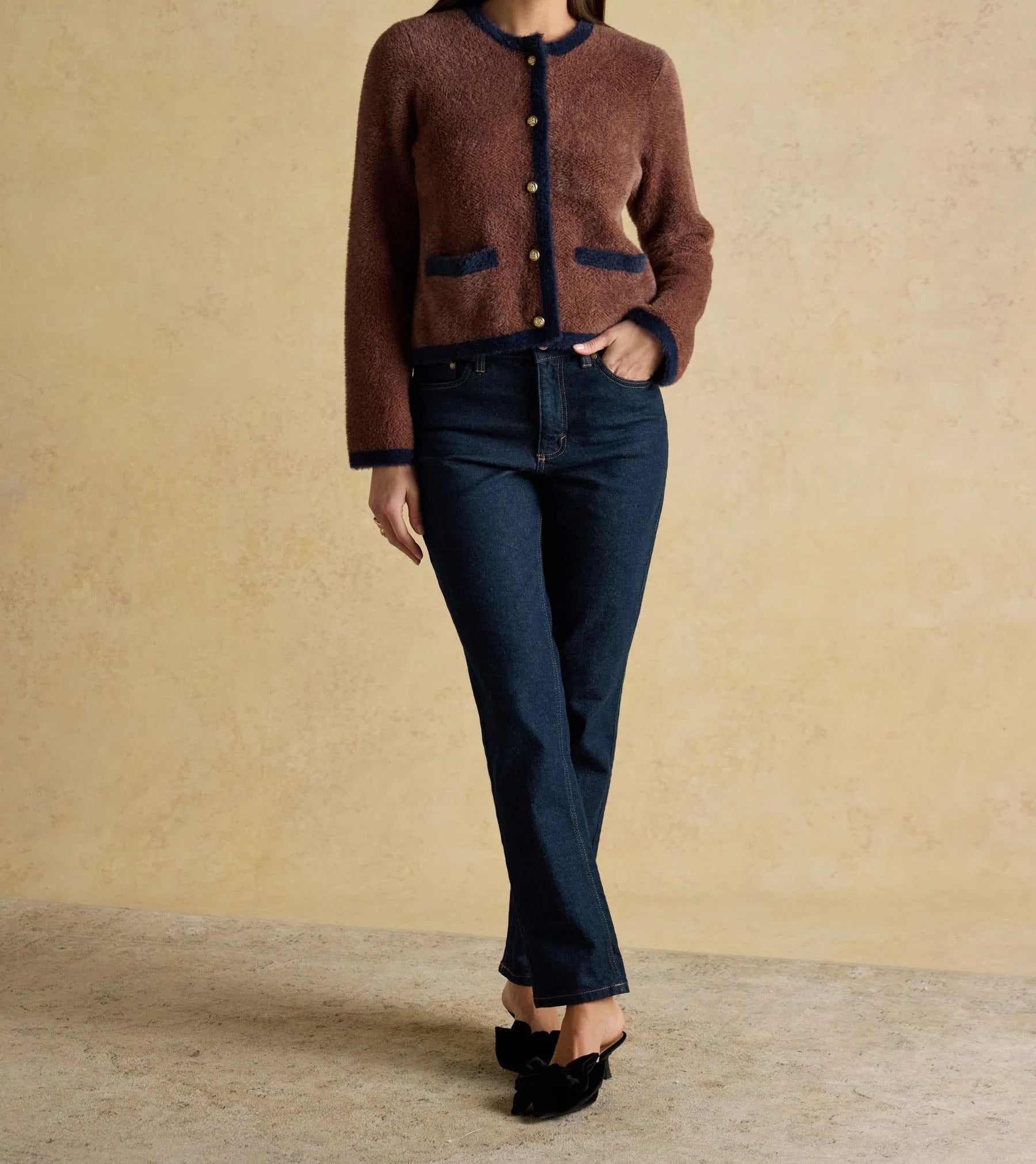 Brown knit cardigan with contrast trim and button closure
