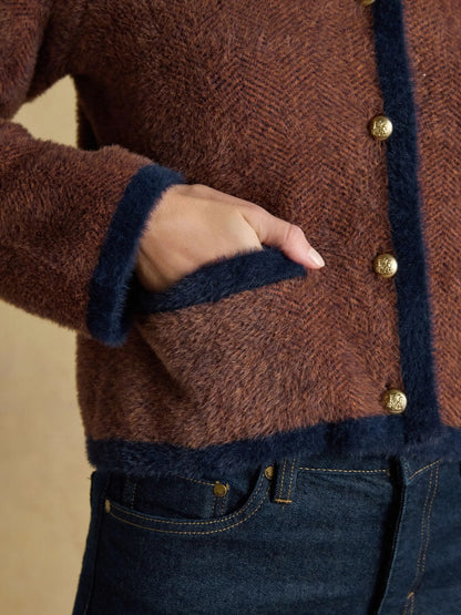Brown knit cardigan with contrast trim and button closure