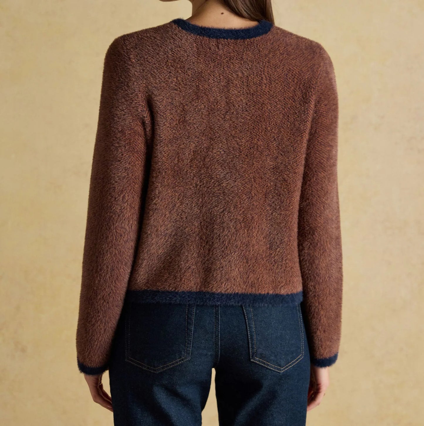 Brown knit cardigan with contrast trim and button closure