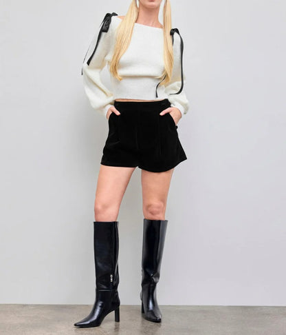 Cream knit sweater with bow shoulder ties and long sleeves