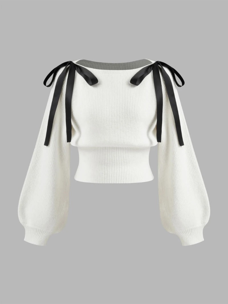 Cream knit sweater with bow shoulder ties and long sleeves