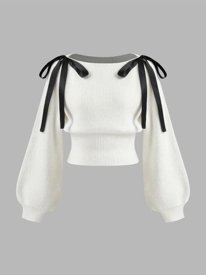 Cream knit sweater with bow shoulder ties and long sleeves