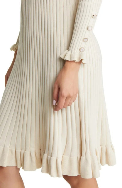 Cream ribbed knit dress with long sleeves and ruffle hem