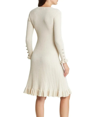 Cream ribbed knit dress with long sleeves and ruffle hem